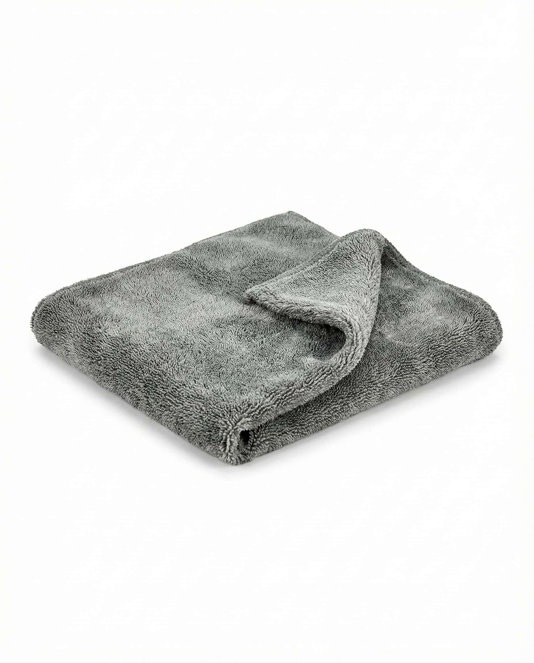 Foto con fondo blanco y microfibra en el centro. Toalla microfibra super absorbente de alta tecnología. 